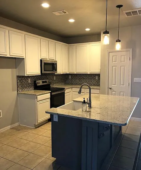 This upgraded kitchen is just one of the highlights of this beautiful home.
