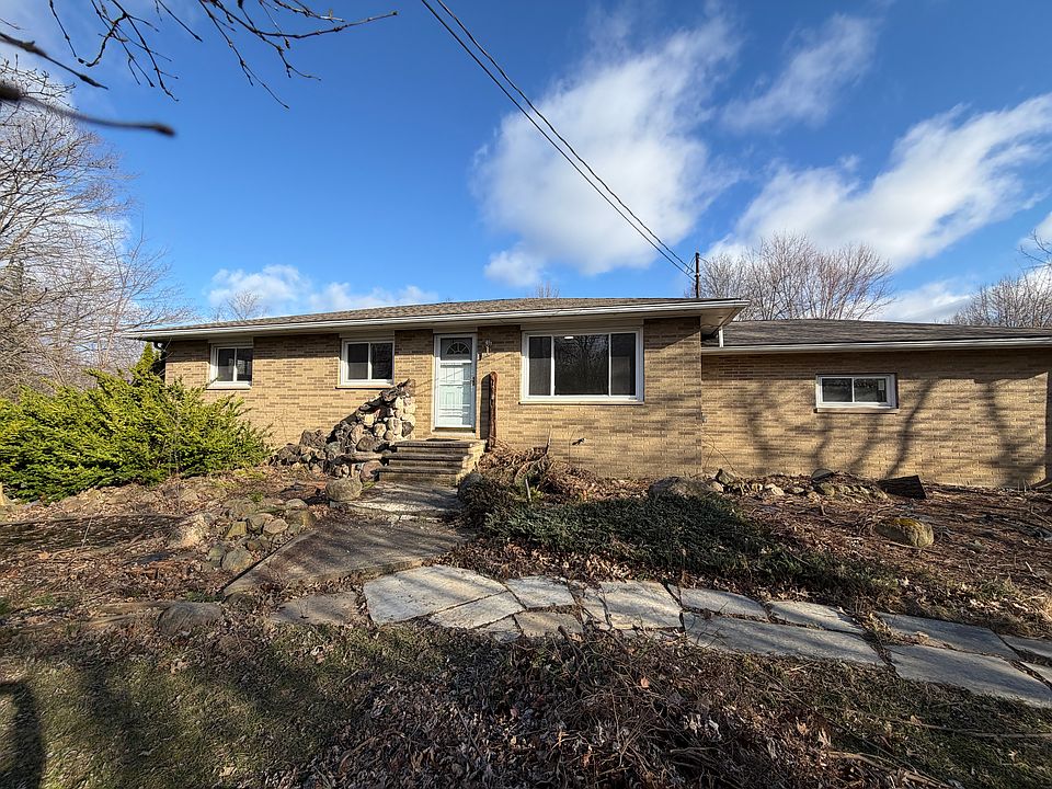 Solid brick ranch with 2 car attached garage.