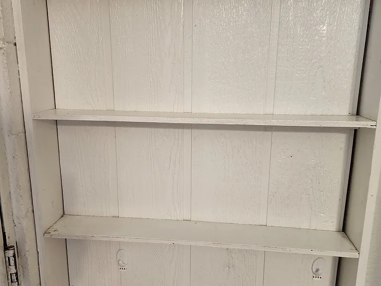 Extra shelving by refrigerator