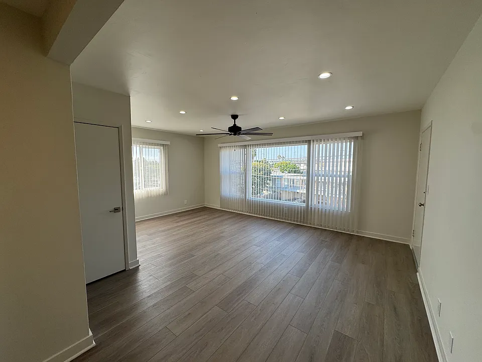 large living room with plenty of windows for natural light