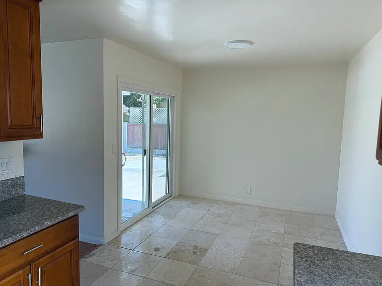 Dining room area leading to personal backyard