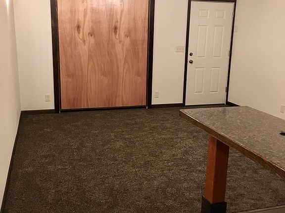 Built into the wall Queen size bed frame and rear entrance