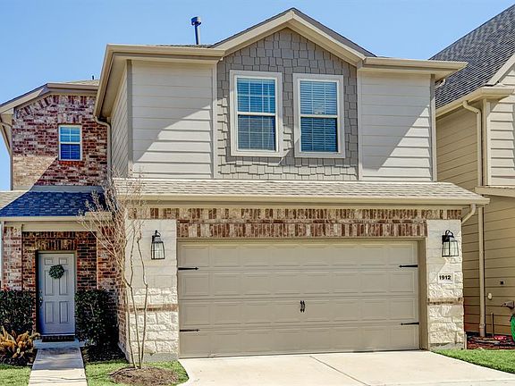Private driveway with roomy garage for two cars!