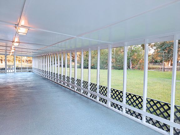 Large screen in porch with lots of green space for your enjoyment.