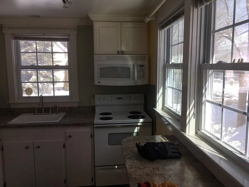 Kitchen with view onto Florence Street and walkway to apartment.