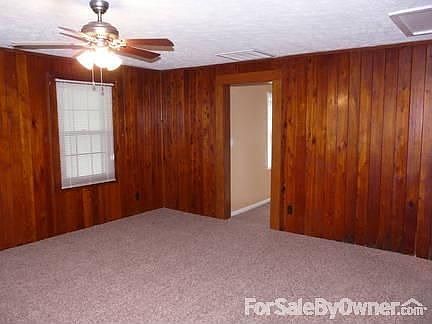 HUGE LIVING ROOM
						:
						25x15 living room w/new carpet & lights, beautiful & original knotty pine walls