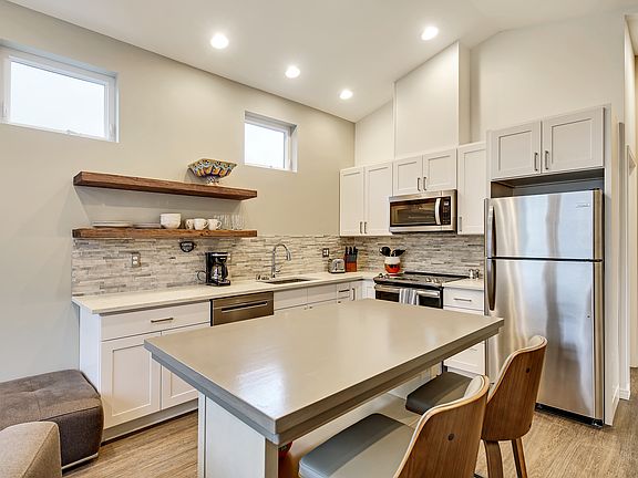 Full size kitchen with stainless steel appliances