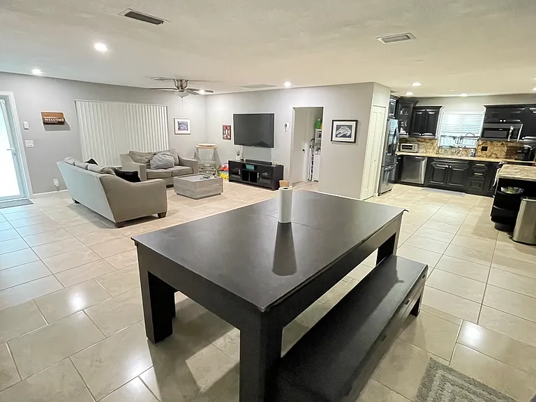 Dining room table that converts into a pool table or ping pong table.