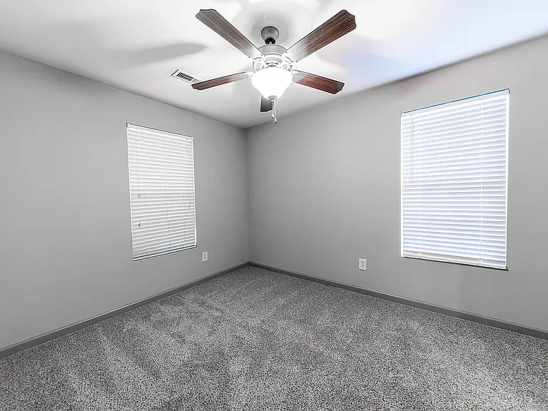 Step into comfort with this well-lit and cozy bedroom ready for your personal touch.