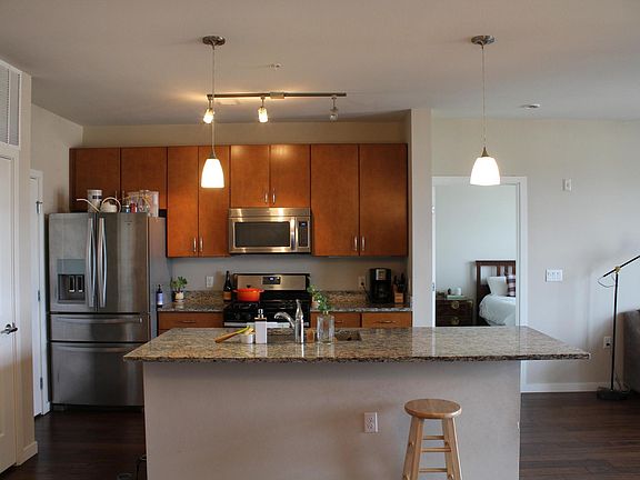 Kitchen with all stainless steel appliances and gas range