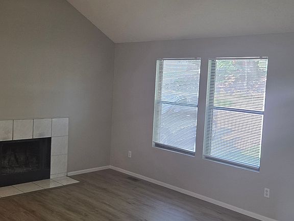 Vaulted ceiling and natural light in open living room