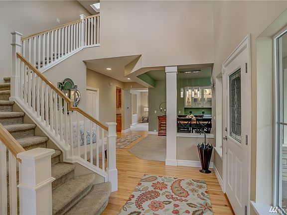 Soaring entrance with newly refinished hardwood floors, $3000 enhancement.