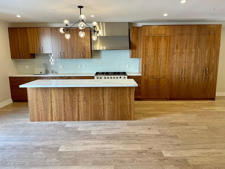Kitchen, built in fridges and pantry cabinets on the right