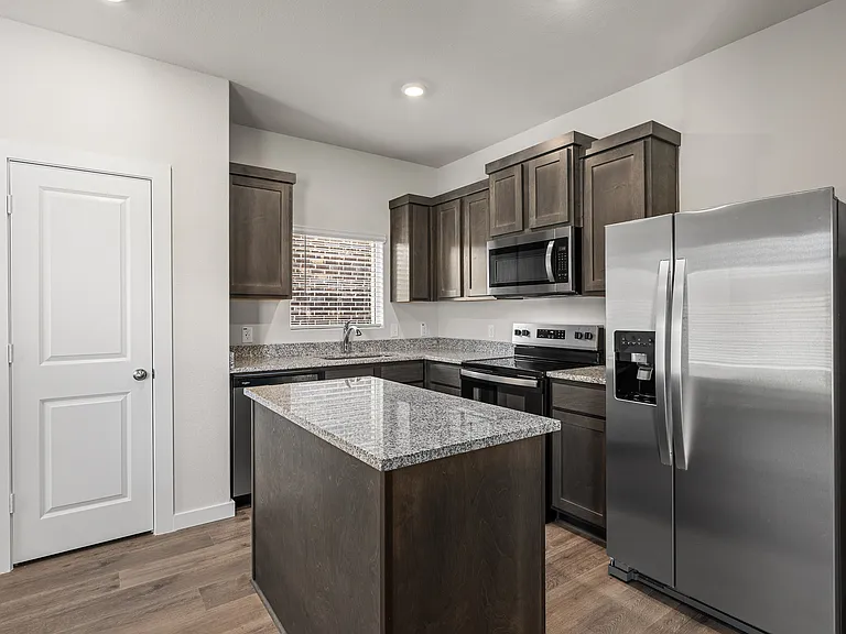 The kitchen has stainless-steel, energy-efficient appliances.
