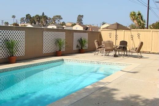 Enjoy you large backyard and sparkling pool