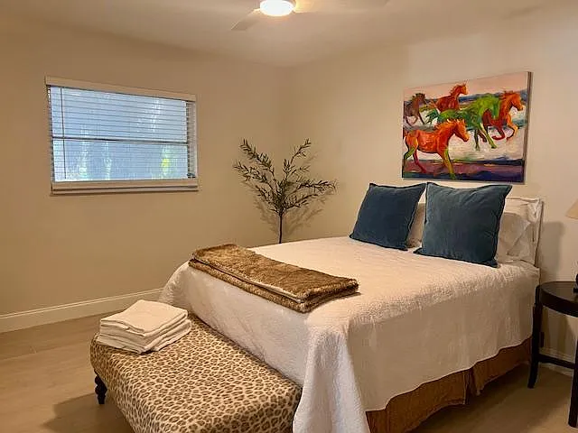 bedroom with original art by local artist