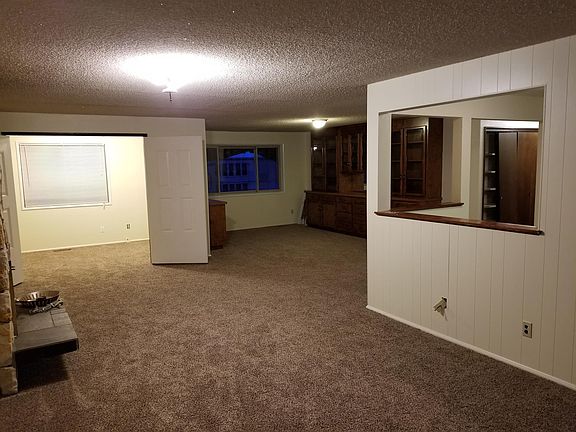 Living Room looking toward 3rd bedroom on left & formal dini