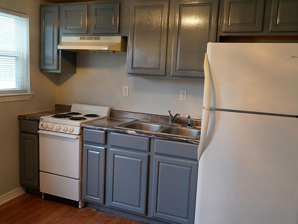 Cute kitchen with new stainless fridge, tiny pantry closet on opposite wall, enough room for a small bistro table for two.