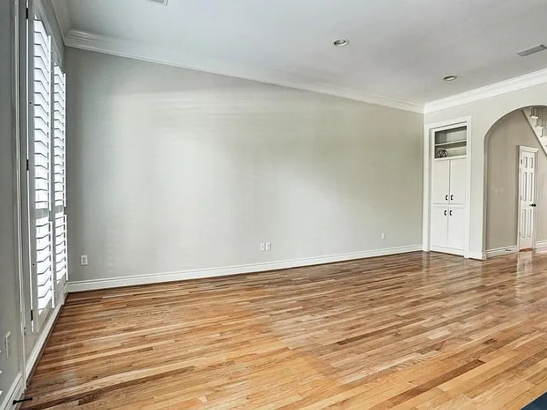 High ceilings throughout with a handy built bookshelf and storage cabinets