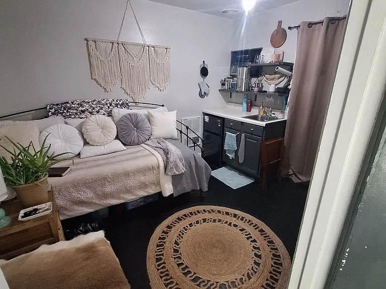 Looking toward mini kitchen from entry Previous resident's furnished view unit is rented unfurnished