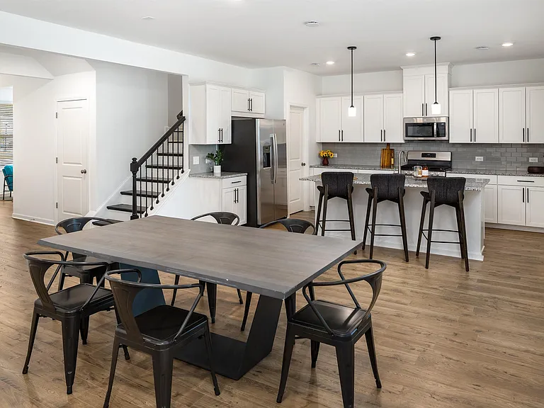 Spacious kitchen with an island, ample storage, and stainless steel appliances.