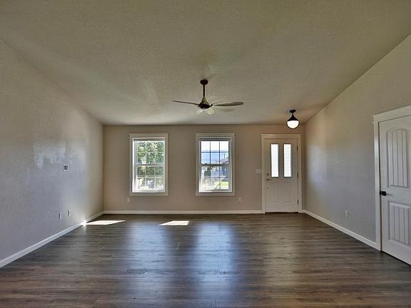 Living room area with coat closet