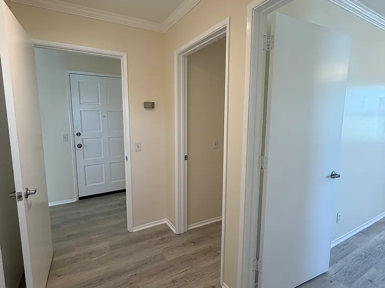 Hallway to bedrooms and bathroom.