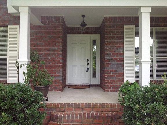 Brick entrance, currently hand rails being installed by fron