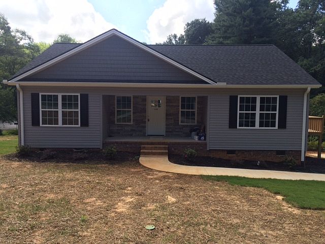 Vinyl/stacked stone front