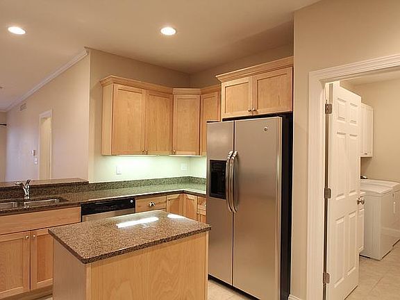 Kitchen right off the laundry room. Stainless steel appliances, granite countertops.