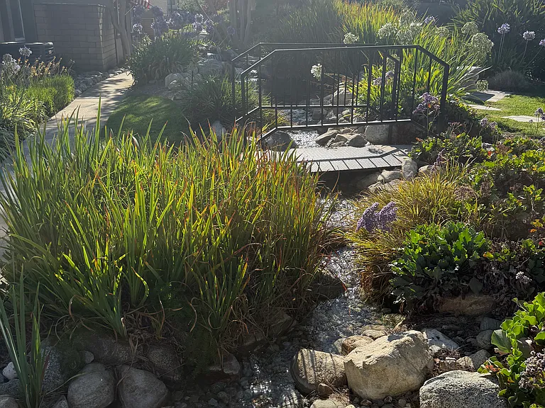 Rock-lined streams, water effects and water bridges make this property like no other.