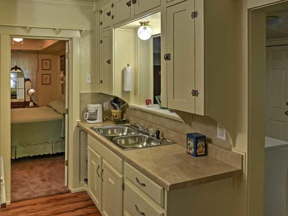 Kitchen with adjoining bedroom.