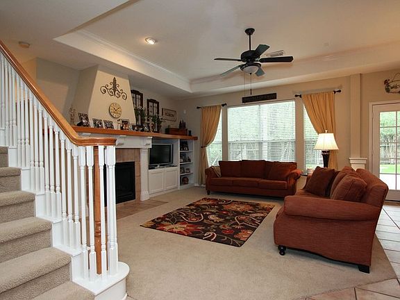 The comfortable family room is open to the kitchen