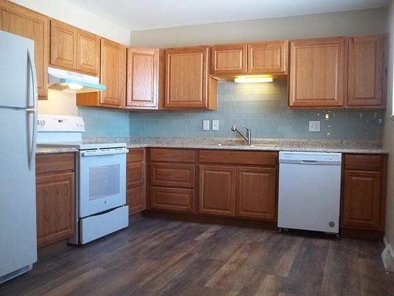 All Brand New Kitchen, All Brand New Appliances, including Glass top STOVE, NEW Counter tops, New Green glass tile Back Splash, New Cabinets, New wood floors, New 6 PANEL Doors, New Vertical blinds in kitchen window and all through unit.