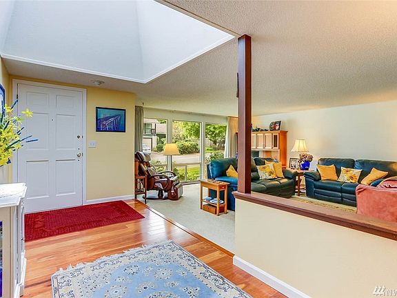 Enter to a large, light-filled entry that overlooks the living room.