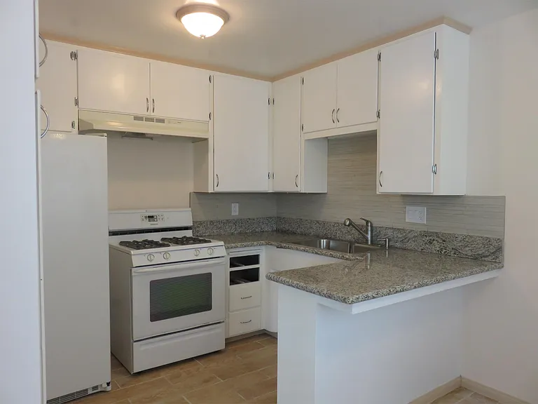 Kitchen has granite counter, gas stove, double door refrigerator,
large sink with garbage disposal.