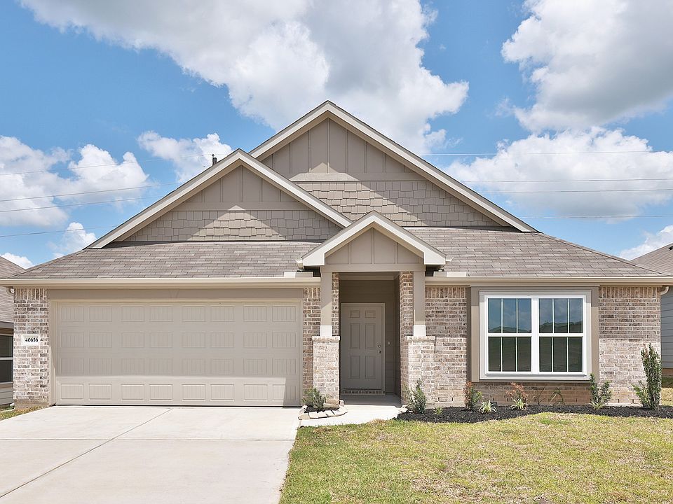 Elegant brick facade with gable roofs and spacious garage in Avalon at Mostyn Springs. Perfect blend