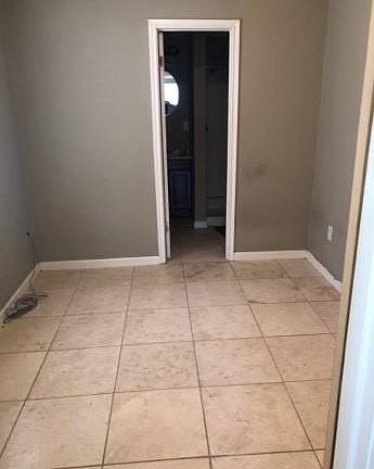 Bedroom 1 connects to bathroom with walk-in shower.