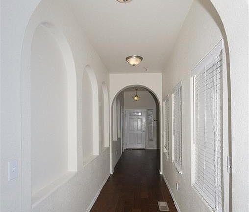 Architectural interest with arches and windows overlooking the courtyard.