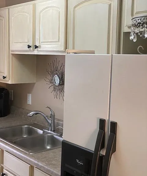 Newly-remodeled kitchen with water/icemaker on door.