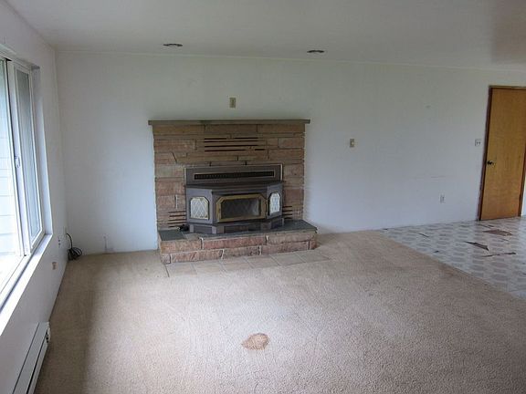 Living Room w/ Cozy Brick Fireplace