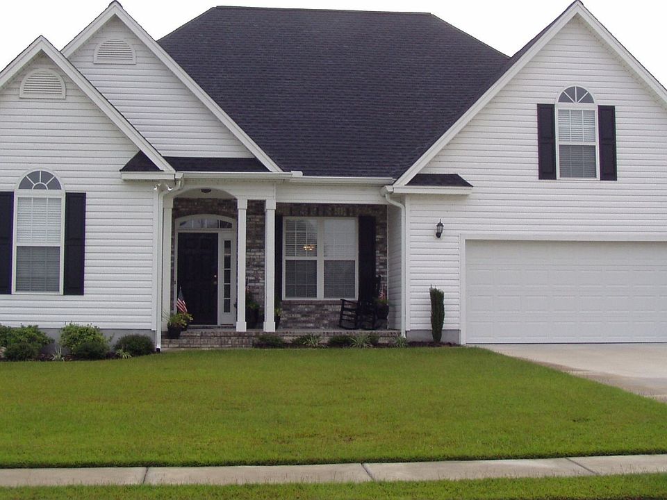 Beautfully Landscaped 4 BR home with true front porch