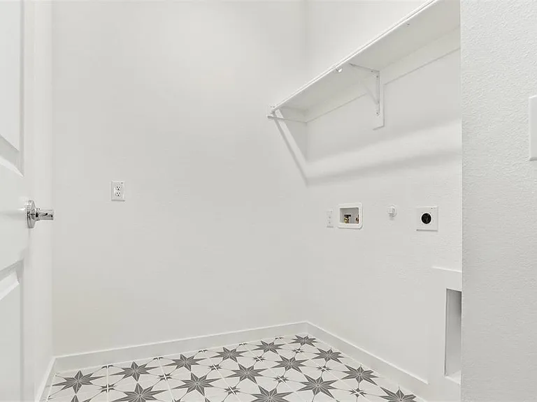 This home includes a spacious laundry room that comes with a washer and dryer adding convenience and extra value for everyday living.