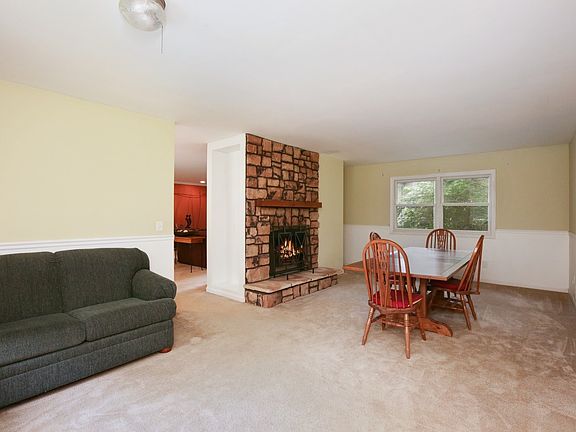 23 ft. long dining room with stone gas fireplace.