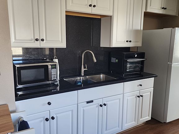 Kitchen sink and full-size refrigerator