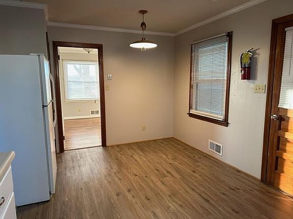Eating area in Kitchen, fridge & large broom closet