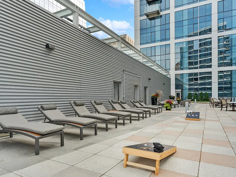 Sun Deck Lounging with Cornhole Games