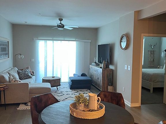 Living area right off of dining area. Beautiful view from patio.