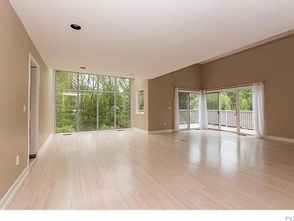 Open living room and dining room with private large deck