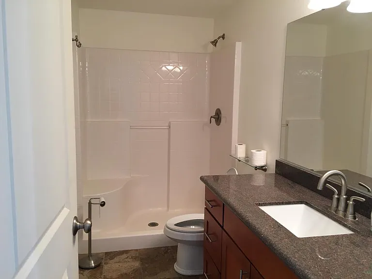 Main floor full bathroom adjoining to main floor bedroom